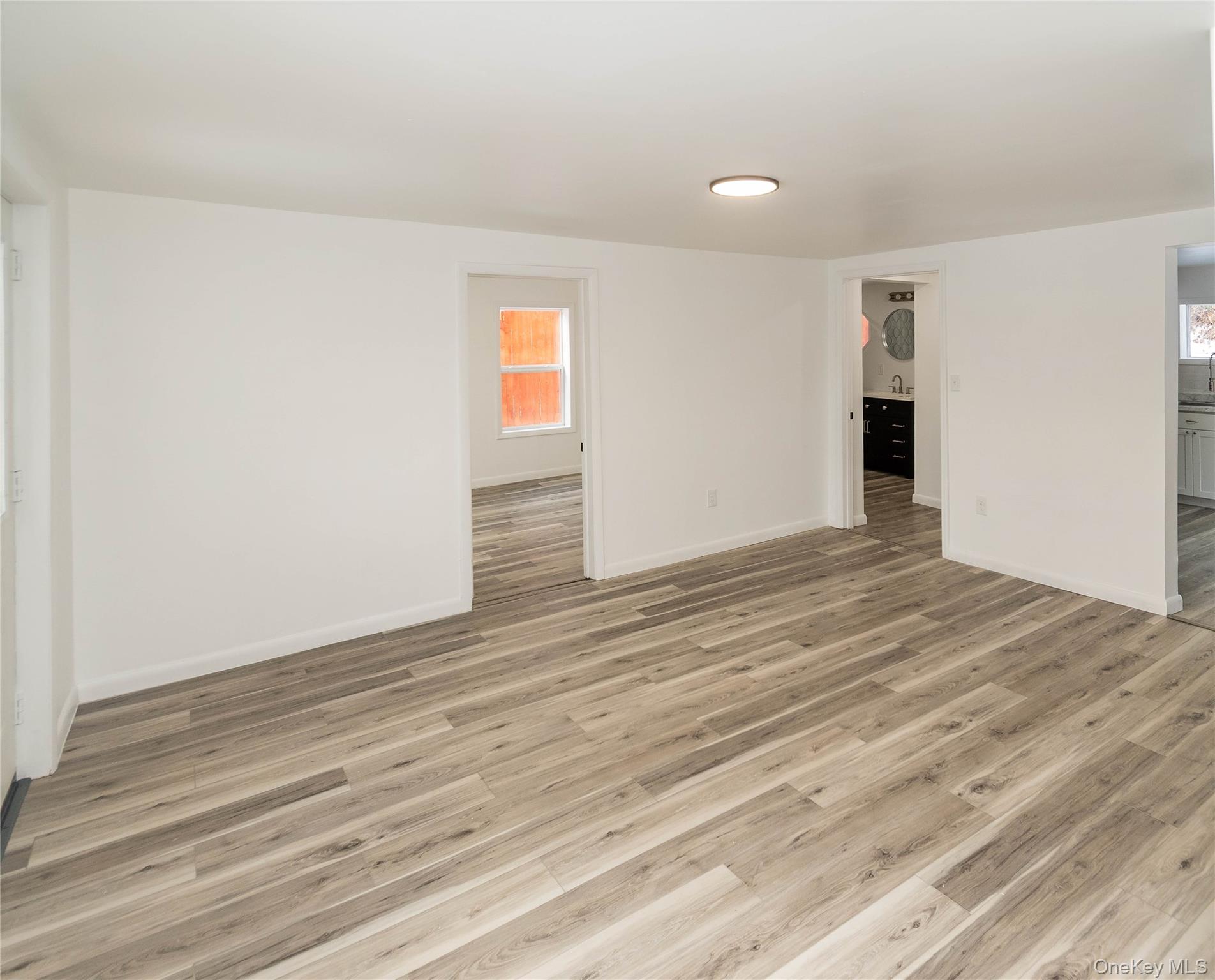112 State Rte 55 Napanoch, NY 12458 - Photo 7 of 42 a view of an empty room with wooden floor and a window