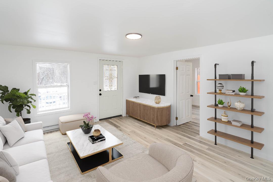 112 State Rte 55 Napanoch, NY 12458 - Photo 8 of 42 a living room with furniture and a flat screen tv