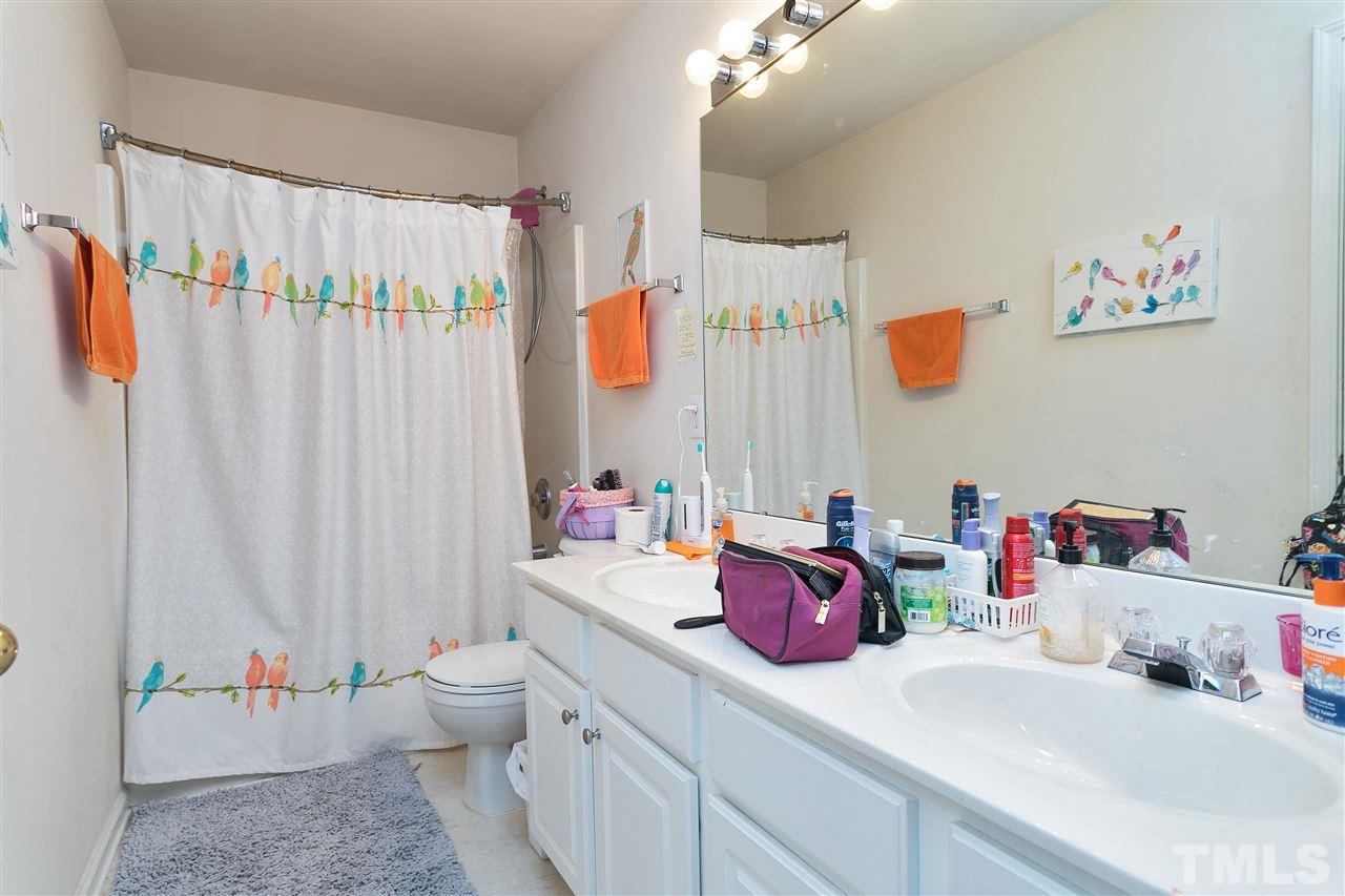 5410 Regatta Way Raleigh, NC 27613 - Photo 13 of 18 a bathroom with a sink vanity and toilet