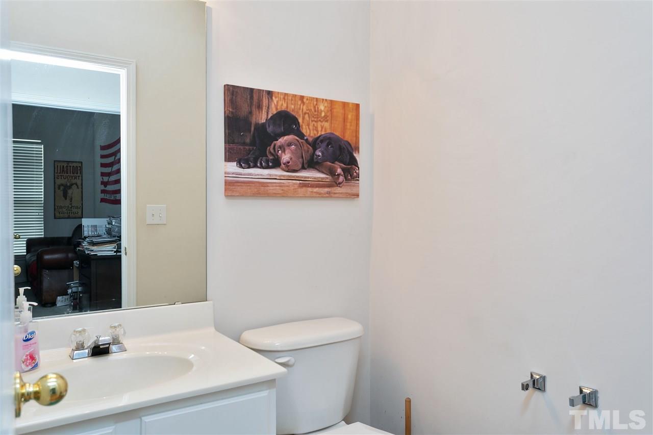 5410 Regatta Way Raleigh, NC 27613 - Photo 14 of 18 a bathroom with a sink and a mirror