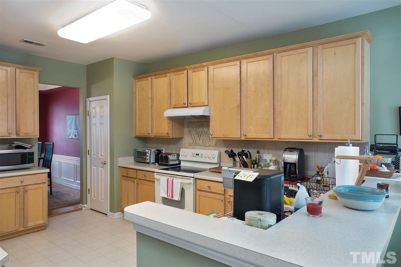 5410 Regatta Way Raleigh, NC 27613 - Photo 3 of 18 a kitchen with a refrigerator and sink