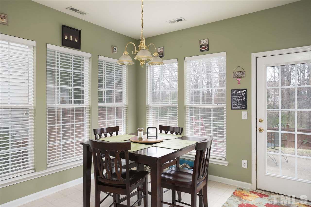 5410 Regatta Way Raleigh, NC 27613 - Photo 4 of 18 a view of a dining room with furniture window and outside view