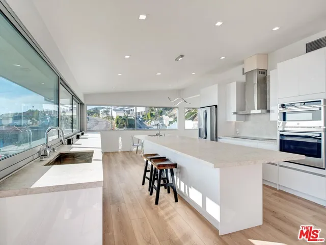 a bathroom with a toilet a sink and bathtub