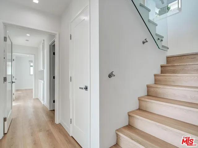 a large white bed in a white room