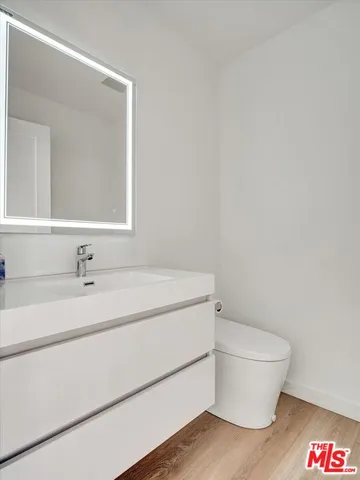 a large bed in a white room