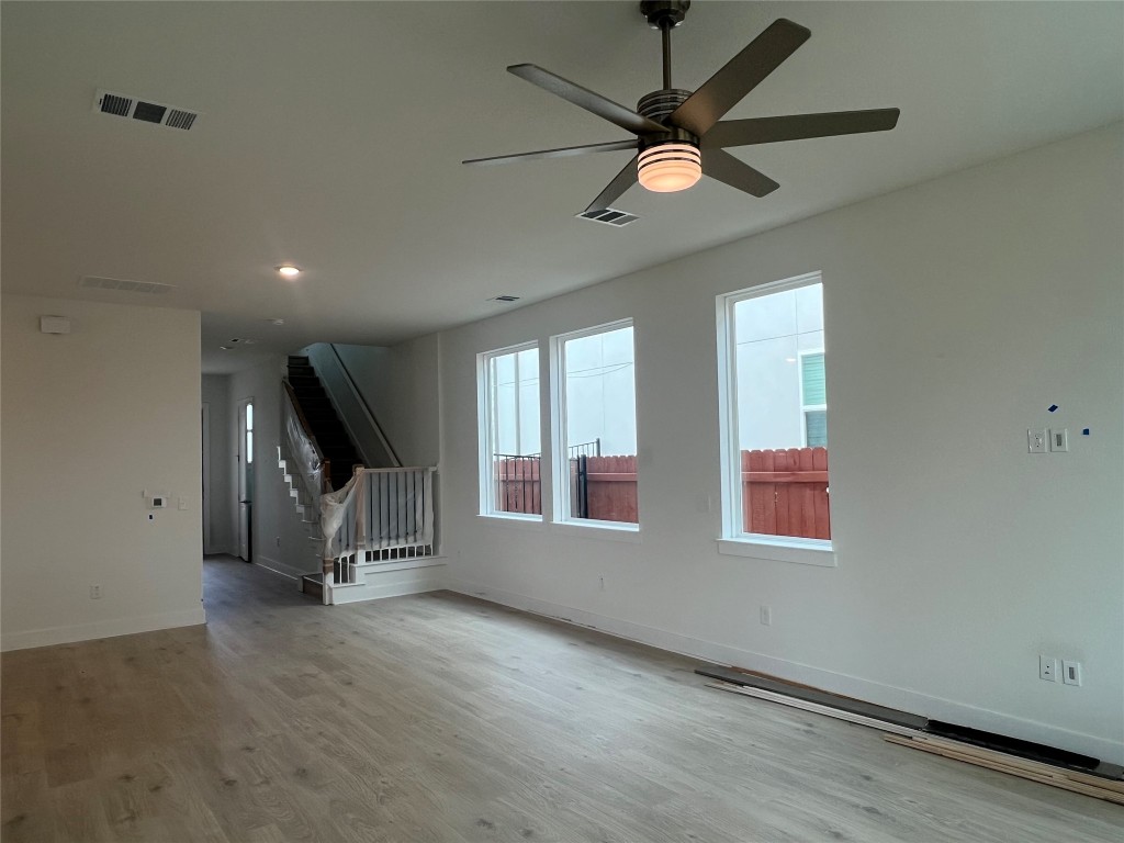 1507 Corsac Way Austin, TX 78758 - Photo 3 of 14 an empty room with ceiling fan and window