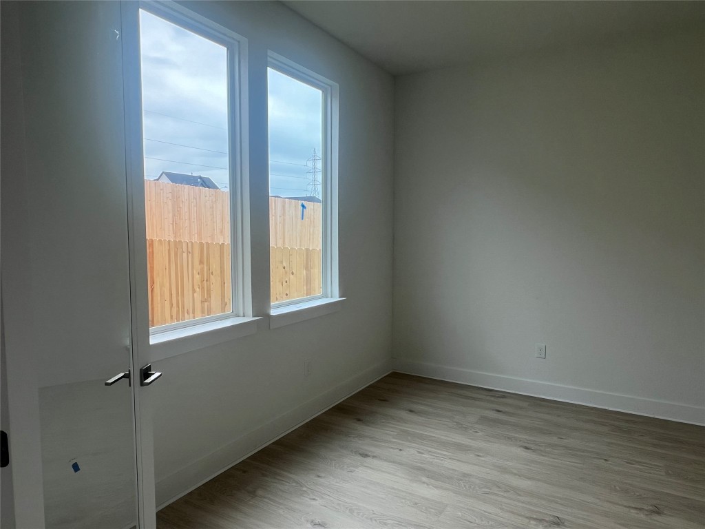 1507 Corsac Way Austin, TX 78758 - Photo 5 of 14 an empty room with a window