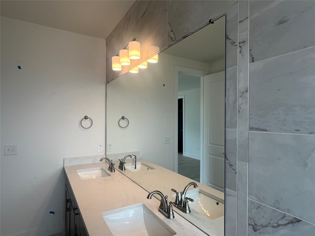 1507 Corsac Way Austin, TX 78758 - Photo 10 of 14 a bathroom with a sink and a mirror