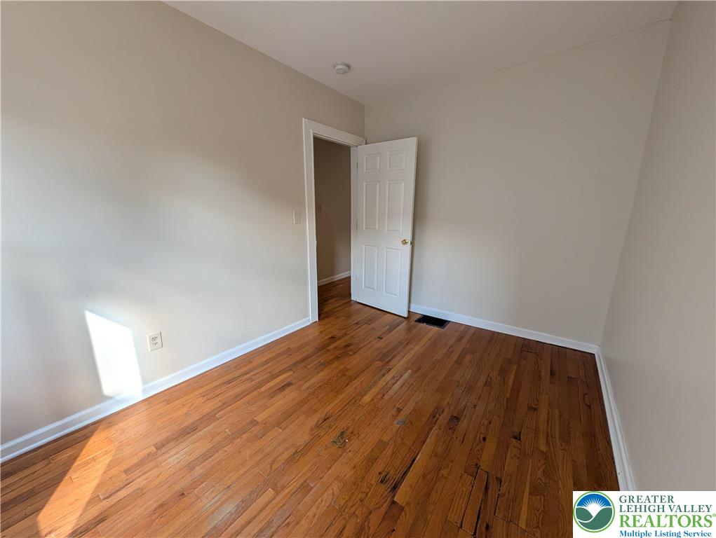 723 Chestnut Street Allentown, PA 18102 - Photo 16 of 25 an empty room with wooden floor
