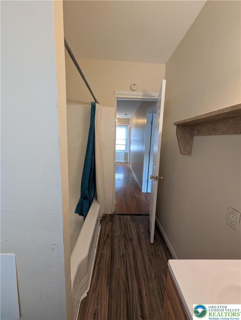 723 Chestnut Street Allentown, PA 18102 - Photo 19 of 25 a view of a hallway with wooden floor and staircase