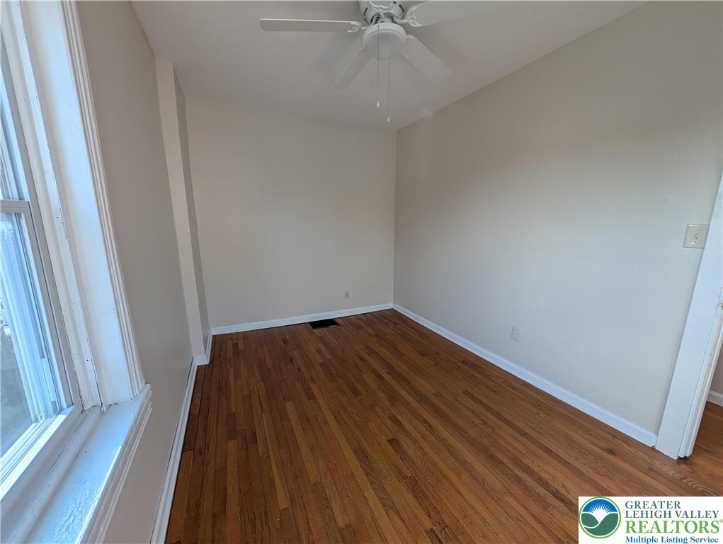 723 Chestnut Street Allentown, PA 18102 - Photo 20 of 25 a view of a hallway with wooden floor