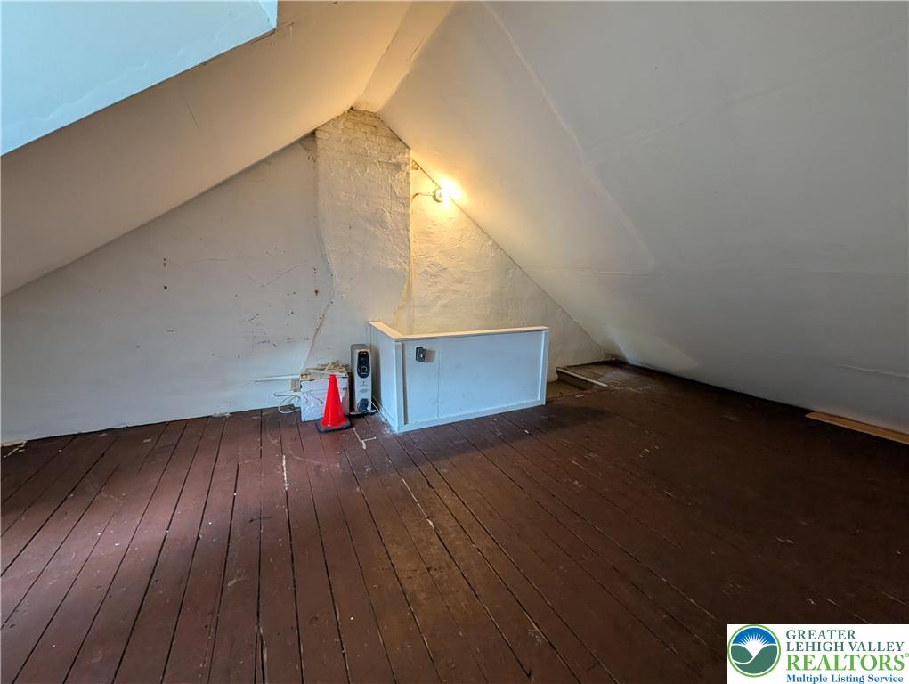 723 Chestnut Street Allentown, PA 18102 - Photo 22 of 25 a view of a room with wooden floor and stairs