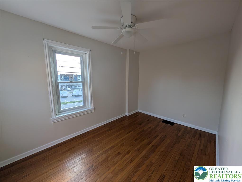 723 Chestnut Street Allentown, PA 18102 - Photo 23 of 25 wooden floor in an empty room with a window