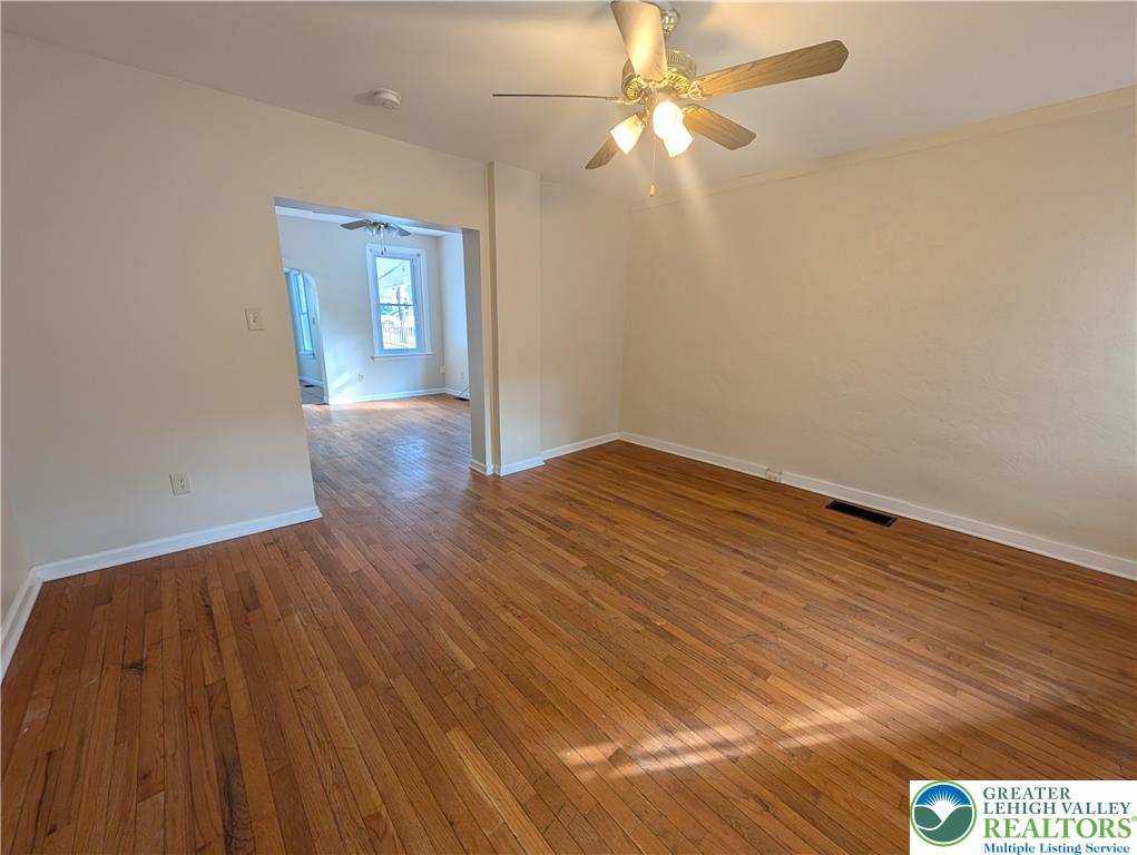 723 Chestnut Street Allentown, PA 18102 - Photo 4 of 25 wooden floor in an empty room with a window