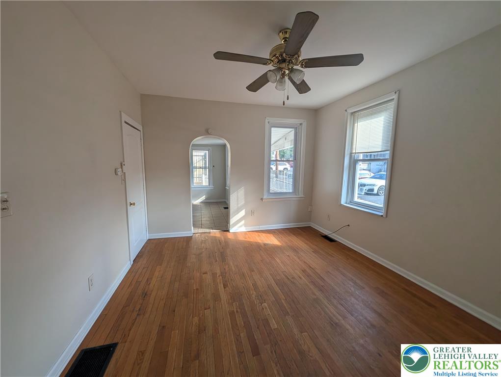 723 Chestnut Street Allentown, PA 18102 - Photo 7 of 25 a view of empty room with wooden floor and fan