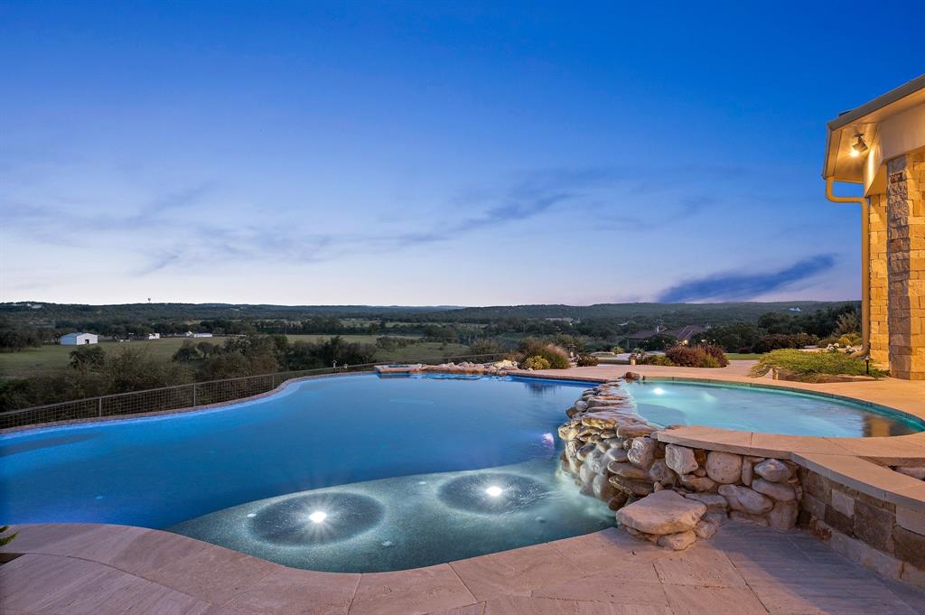 325 River Ridge Spring Branch, TX 78070 - Photo 10 of 40 a view of a swimming pool and city from a balcony