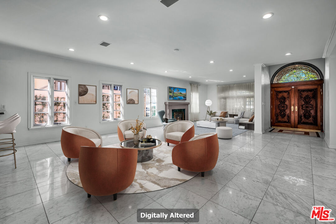 10810 Rochester Avenue Los Angeles, CA 90024 - Photo 1 of 33 a living room with furniture and a large window