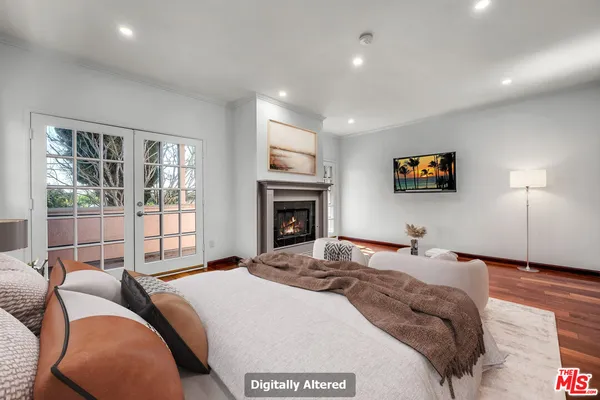a bedroom with a large bed and a large window