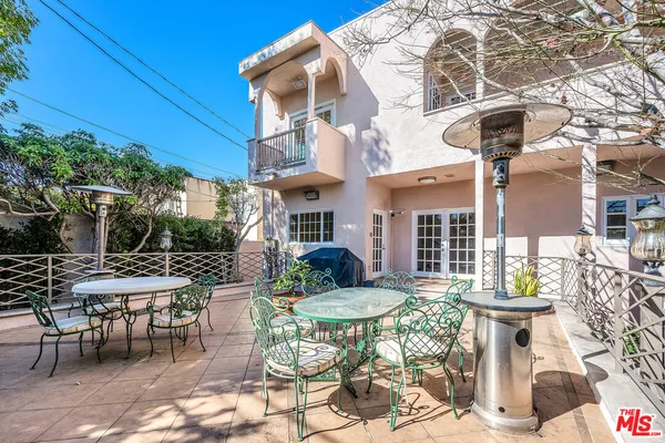 a view of a table and chairs in the patio