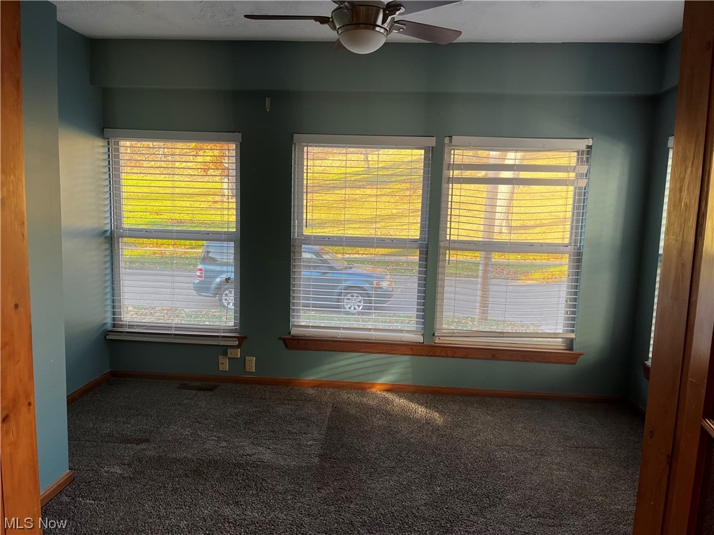 1610 Malasia Road Akron, OH 44305 - Photo 7 of 14 Carpeted empty room featuring ceiling fan