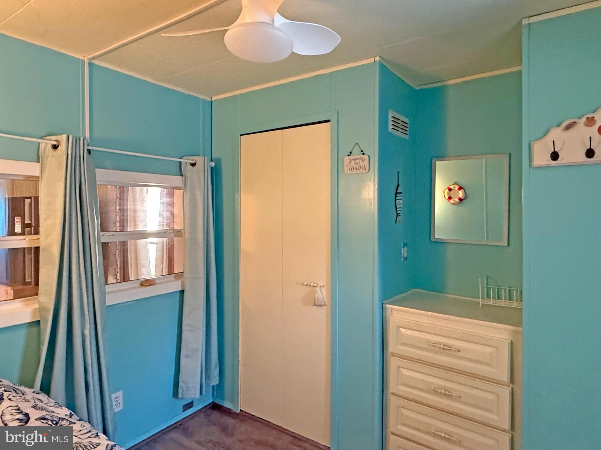 38306 Squirrel Road, Unit 217 Ocean View, DE 19970 - Photo 13 of 28 a view of a bathroom with a sink and a mirror