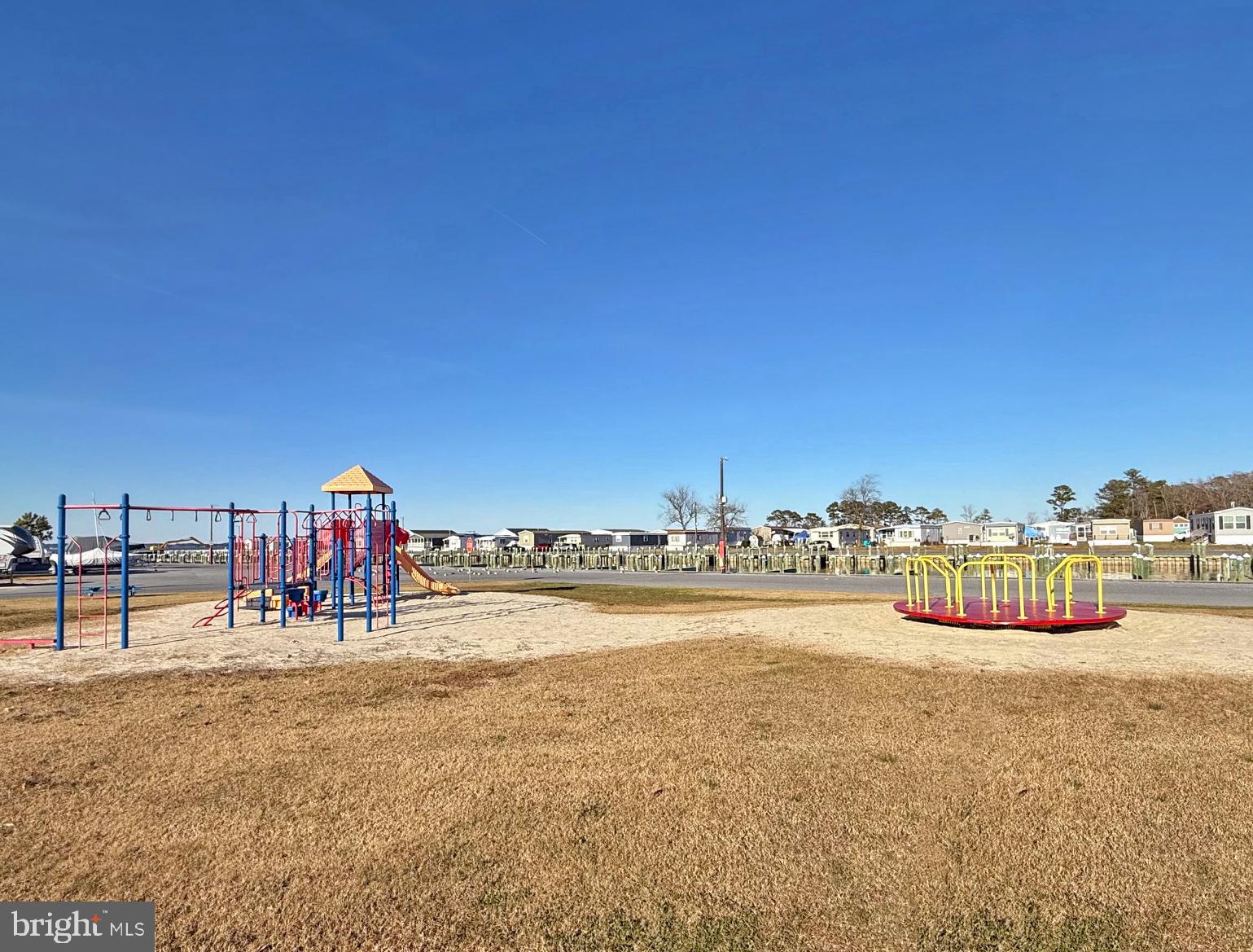 38306 Squirrel Road, Unit 217 Ocean View, DE 19970 - Photo 25 of 28 a view of a swimming pool with an ocean view