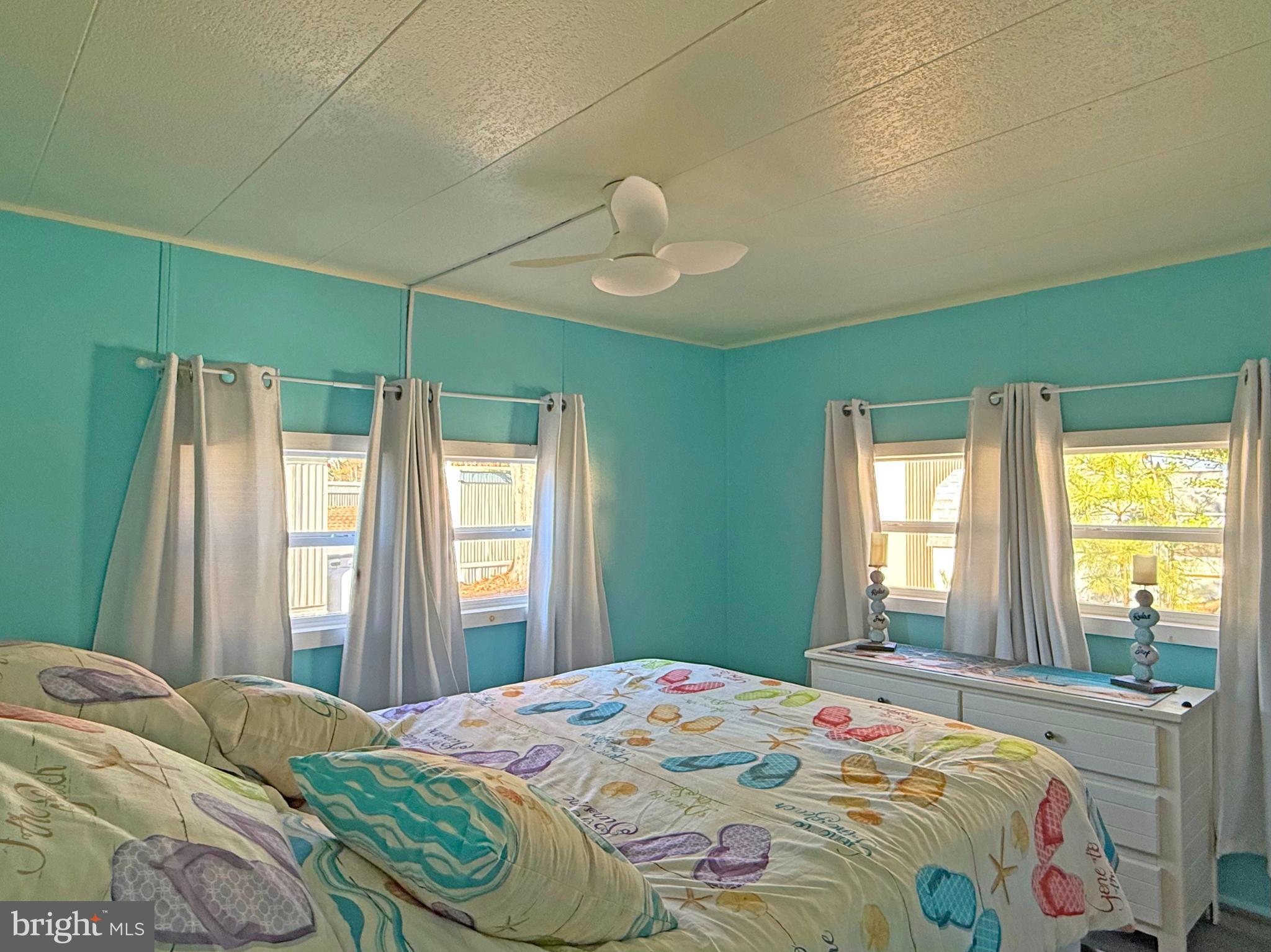38306 Squirrel Road, Unit 217 Ocean View, DE 19970 - Photo 8 of 28 a bedroom with a bed and a window