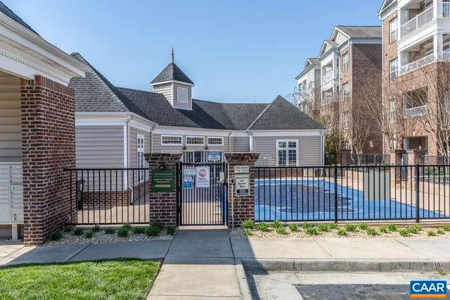 a view of a house with a wooden deck