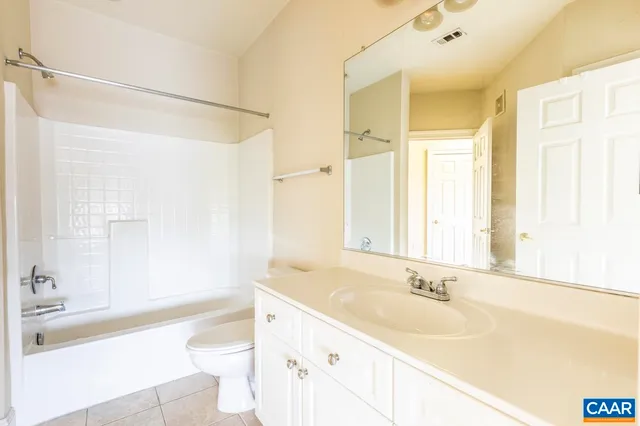 a bathroom with a sink a toilet and a bathtub