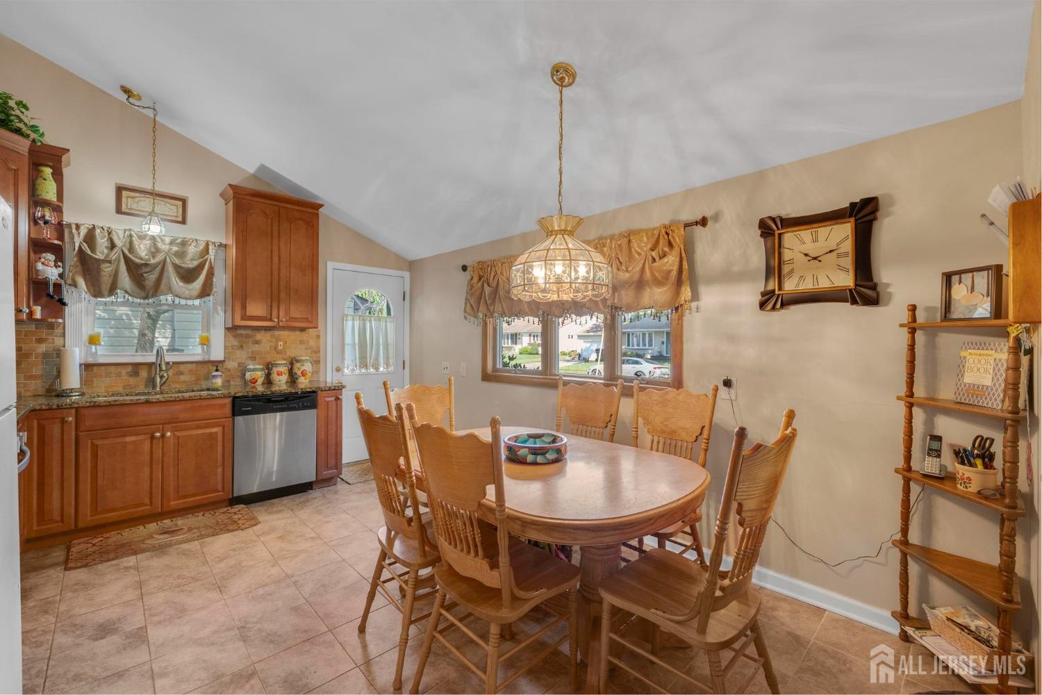 77 Albemarle Road Colonia, NJ 07067 - Photo 11 of 30 a dining room with furniture and window