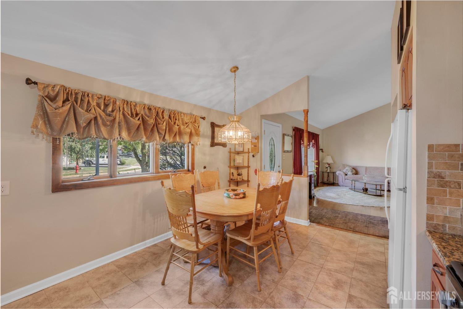 77 Albemarle Road Colonia, NJ 07067 - Photo 14 of 30 a view of a dining room with furniture window and outside view