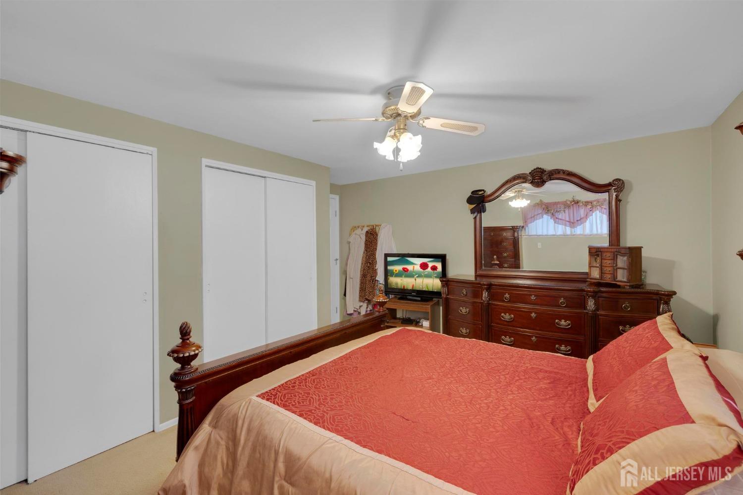 77 Albemarle Road Colonia, NJ 07067 - Photo 17 of 30 a bedroom with a bed and a dresser