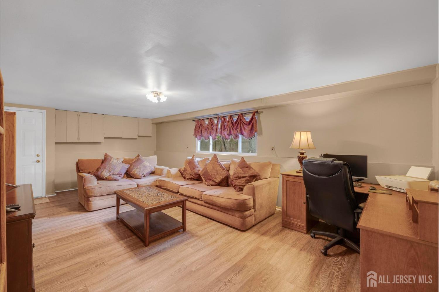 77 Albemarle Road Colonia, NJ 07067 - Photo 21 of 30 a living room with furniture
