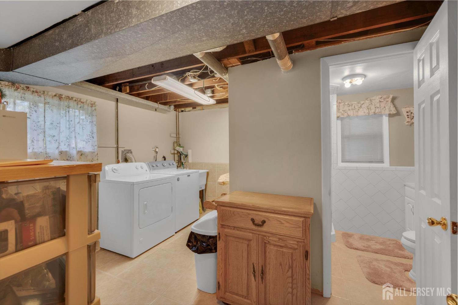 77 Albemarle Road Colonia, NJ 07067 - Photo 24 of 30 a utility room with a washer and dryer