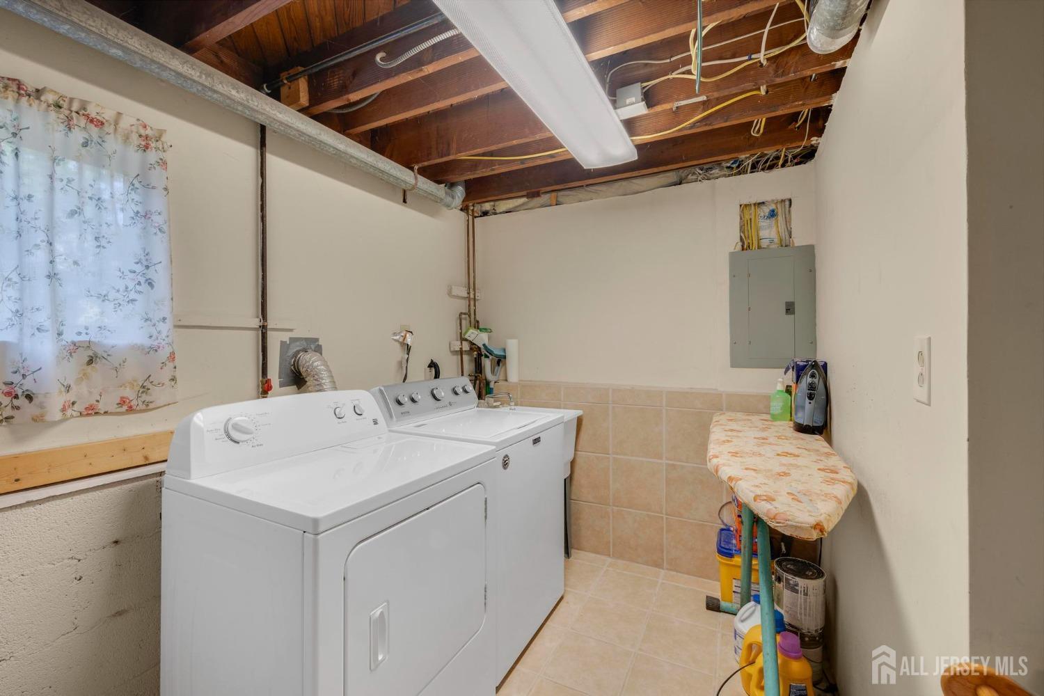 77 Albemarle Road Colonia, NJ 07067 - Photo 25 of 30 a utility room with a sink dryer and washer
