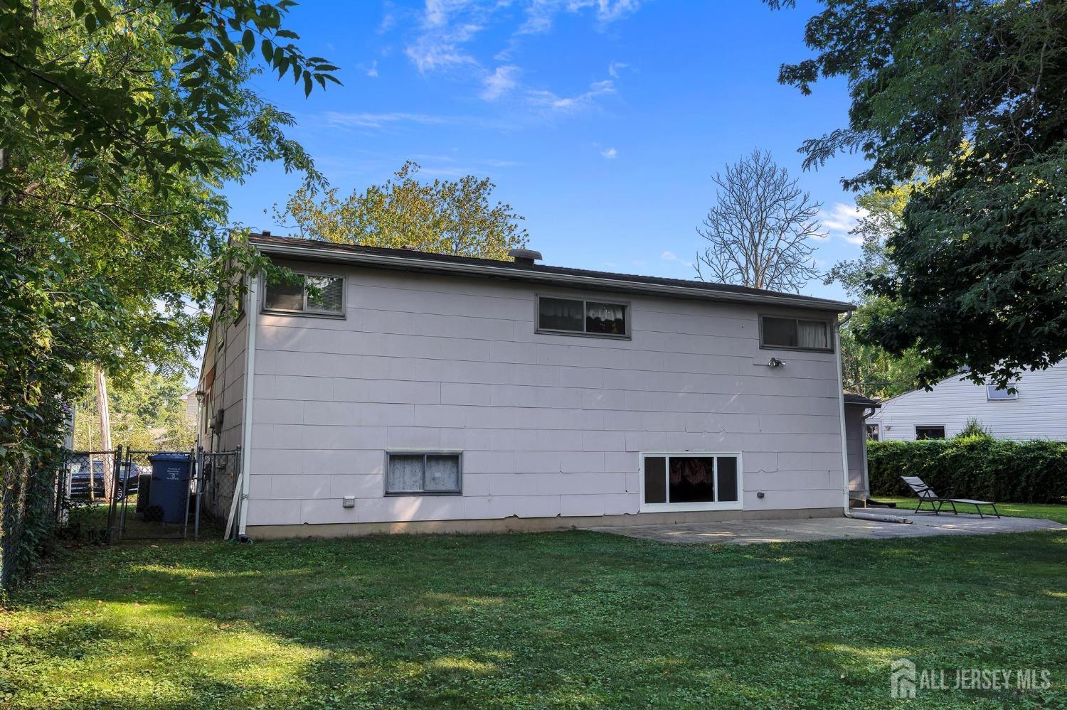 77 Albemarle Road Colonia, NJ 07067 - Photo 3 of 30 a front view of a house with a garden