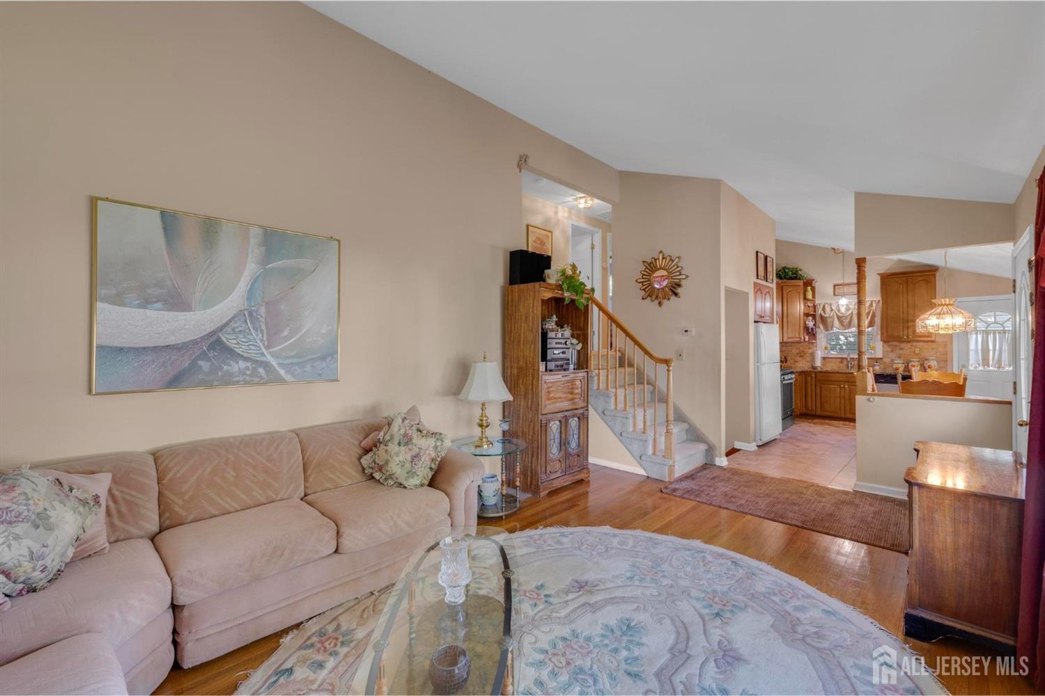 77 Albemarle Road Colonia, NJ 07067 - Photo 10 of 30 a living room with furniture and wooden floor