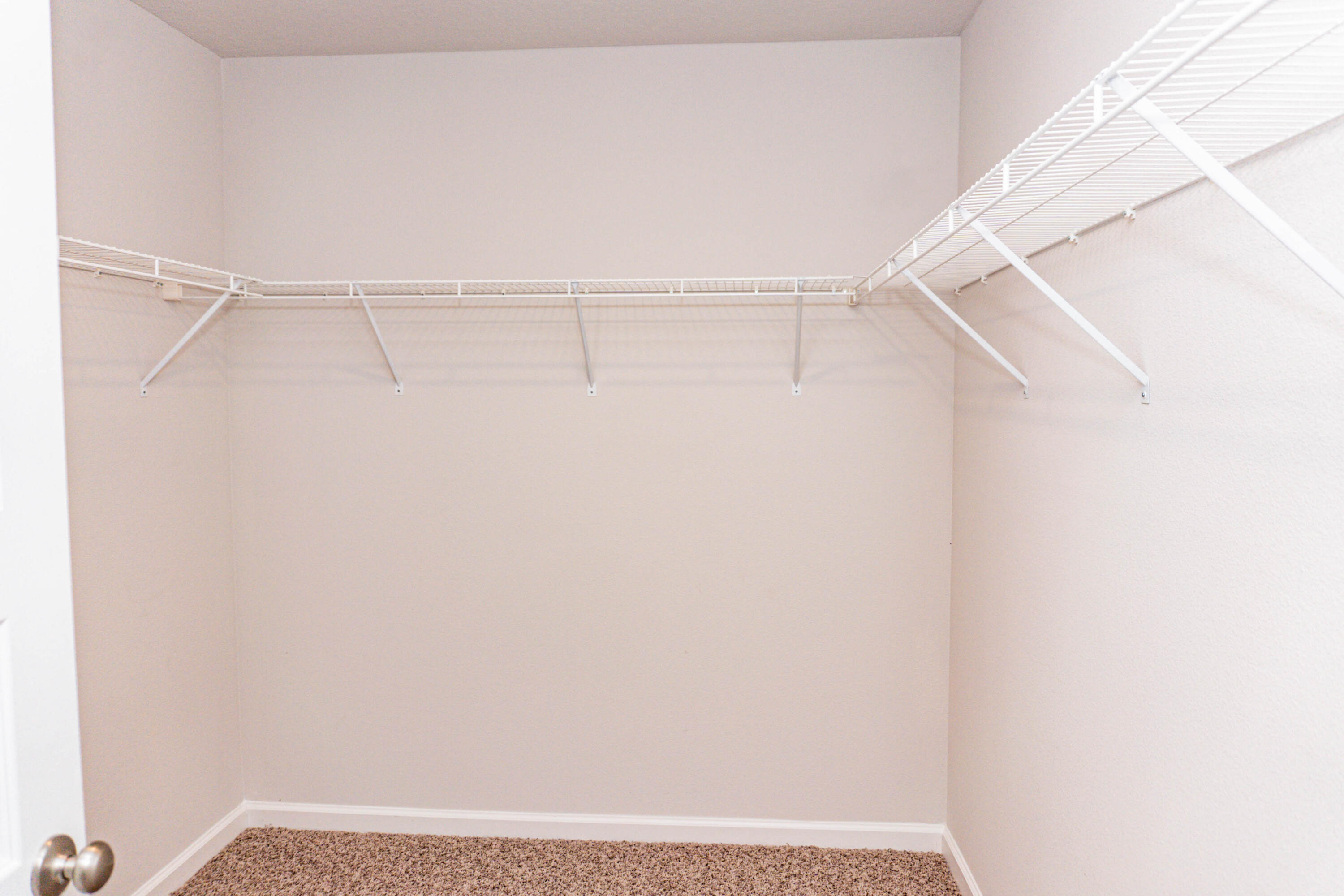202 Laurel Hill Street Crestview, FL 32539 - Photo 11 of 25 a view of an empty walk in closet