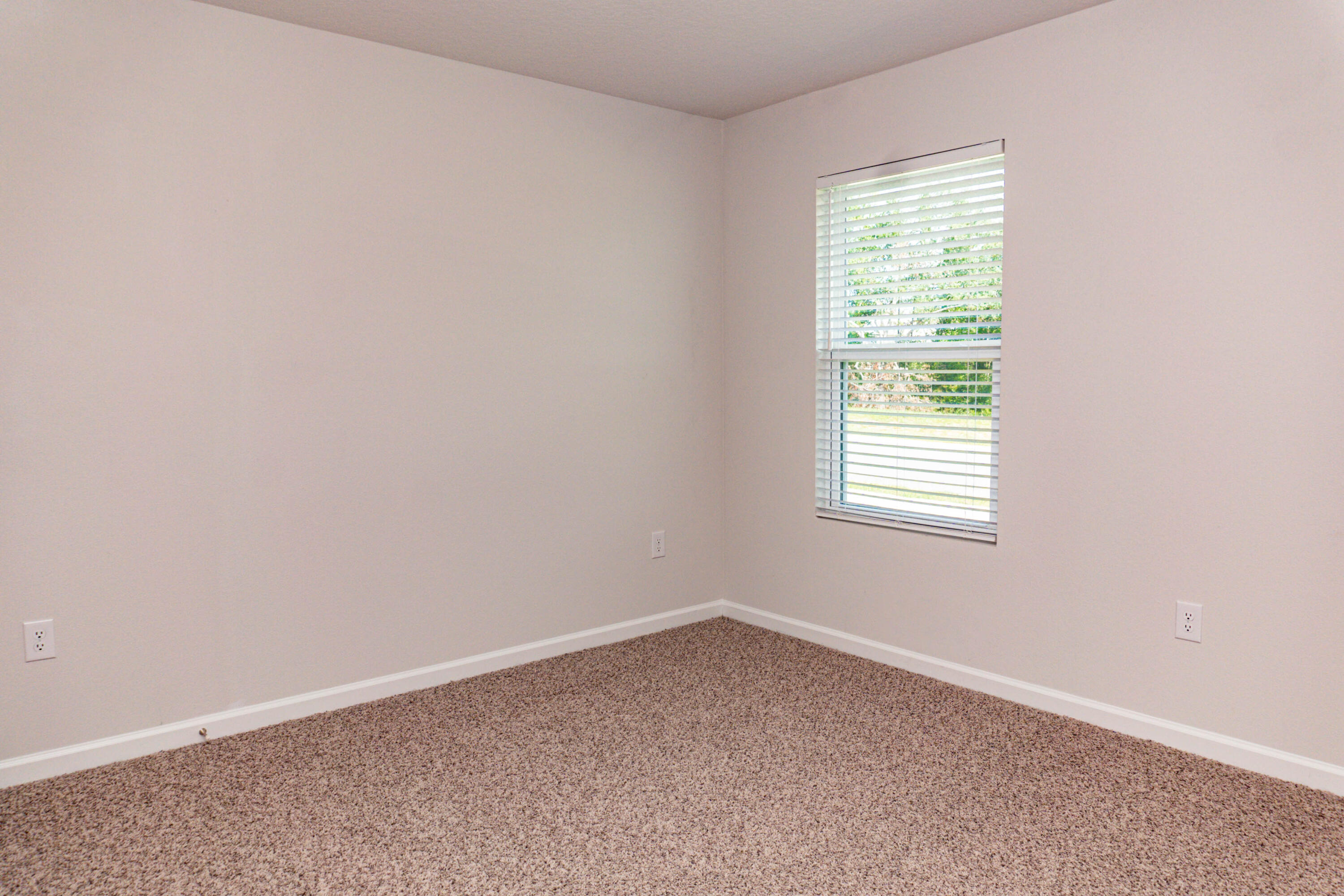 202 Laurel Hill Street Crestview, FL 32539 - Photo 16 of 25 an empty room with a window
