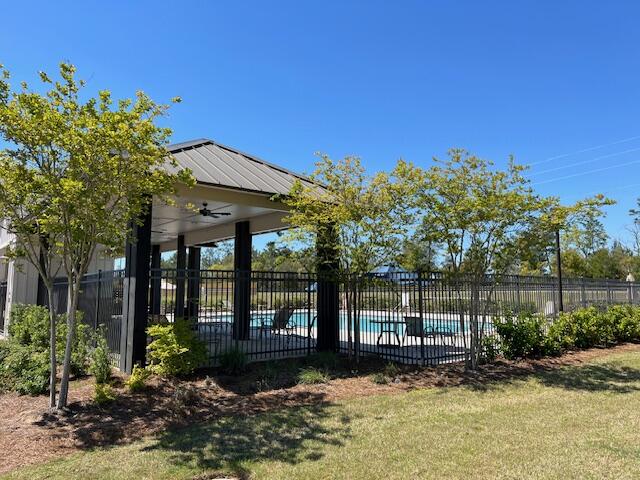 202 Laurel Hill Street Crestview, FL 32539 - Photo 23 of 25 a view of a house with backyard and sitting area