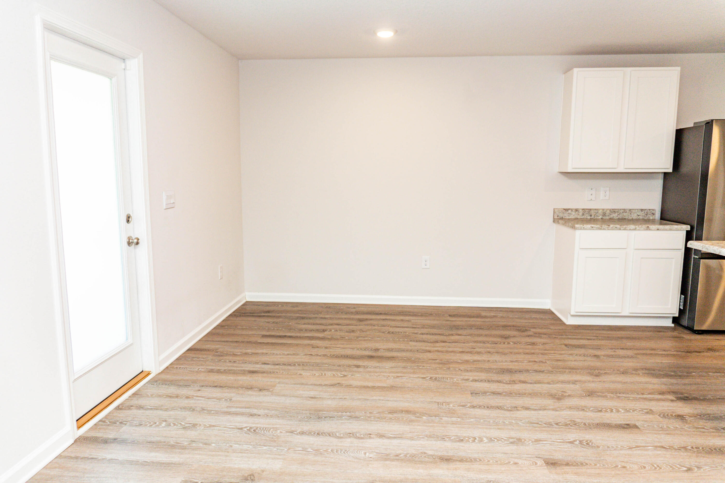 202 Laurel Hill Street Crestview, FL 32539 - Photo 6 of 25 a view of kitchen with wooden floor