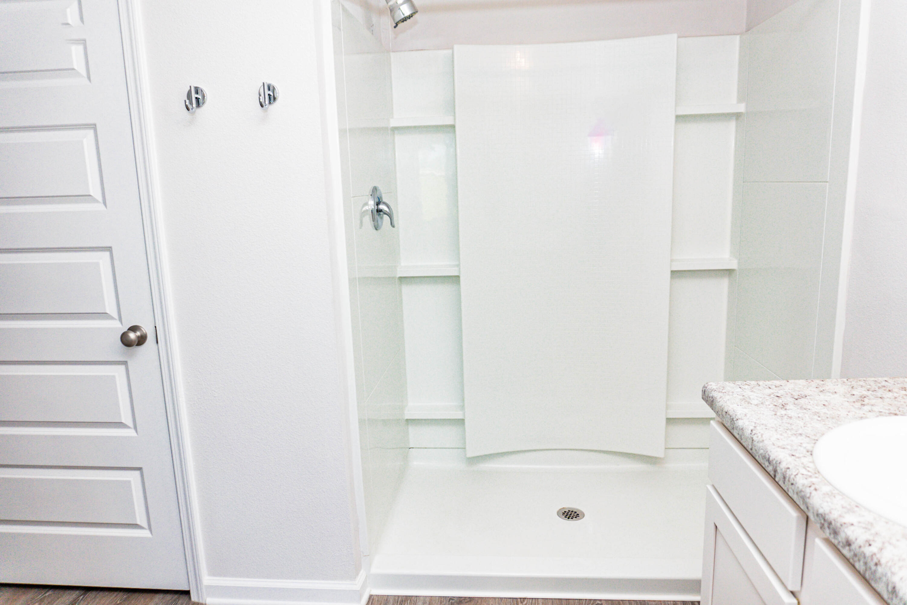 202 Laurel Hill Street Crestview, FL 32539 - Photo 10 of 25 a bathroom with a granite countertop shower and a sink