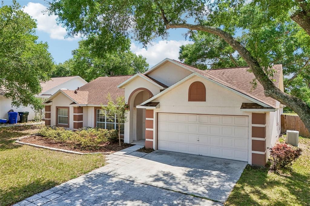 2596 Alclobe Circle Ocoee, FL 34761 - Photo 6 of 70 a view of a yard in front of a house