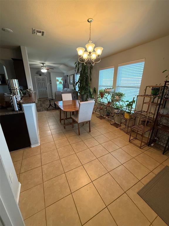 120 Chalk Road Anna, TX 75409 - Photo 12 of 29 a view of a dining room with furniture and chandelier