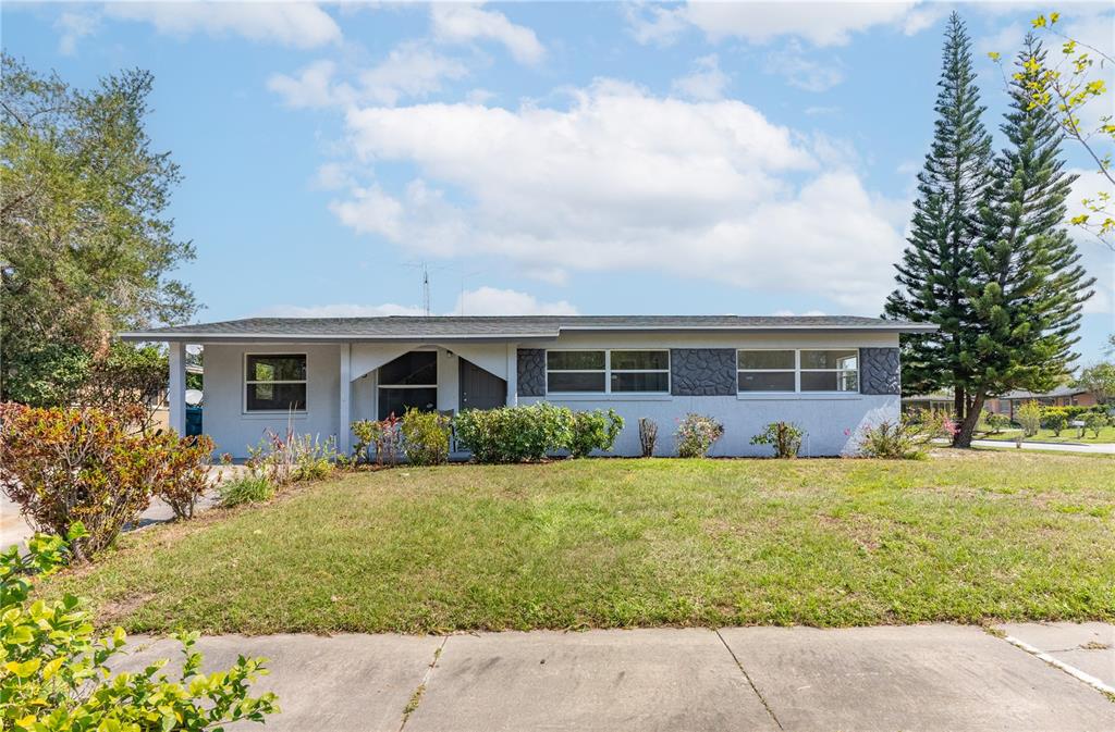 1423 Heber Circle Orlando, FL 32811 - Photo 1 of 1 a front view of house with yard and green space