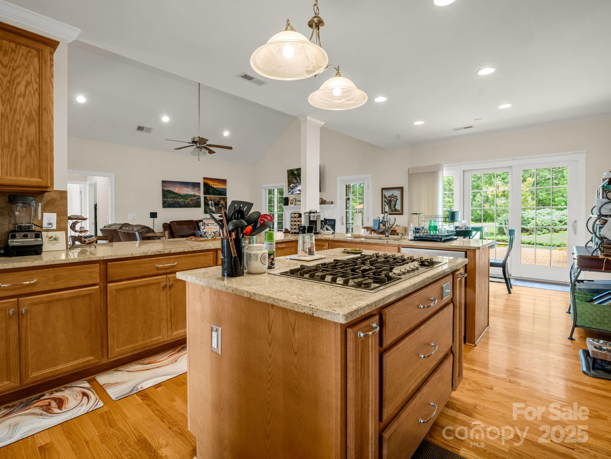 188 Jamesfield Drive Rutherfordton, NC 28139 - Photo 14 of 45 a kitchen with kitchen island a stove a sink a dining table and chairs