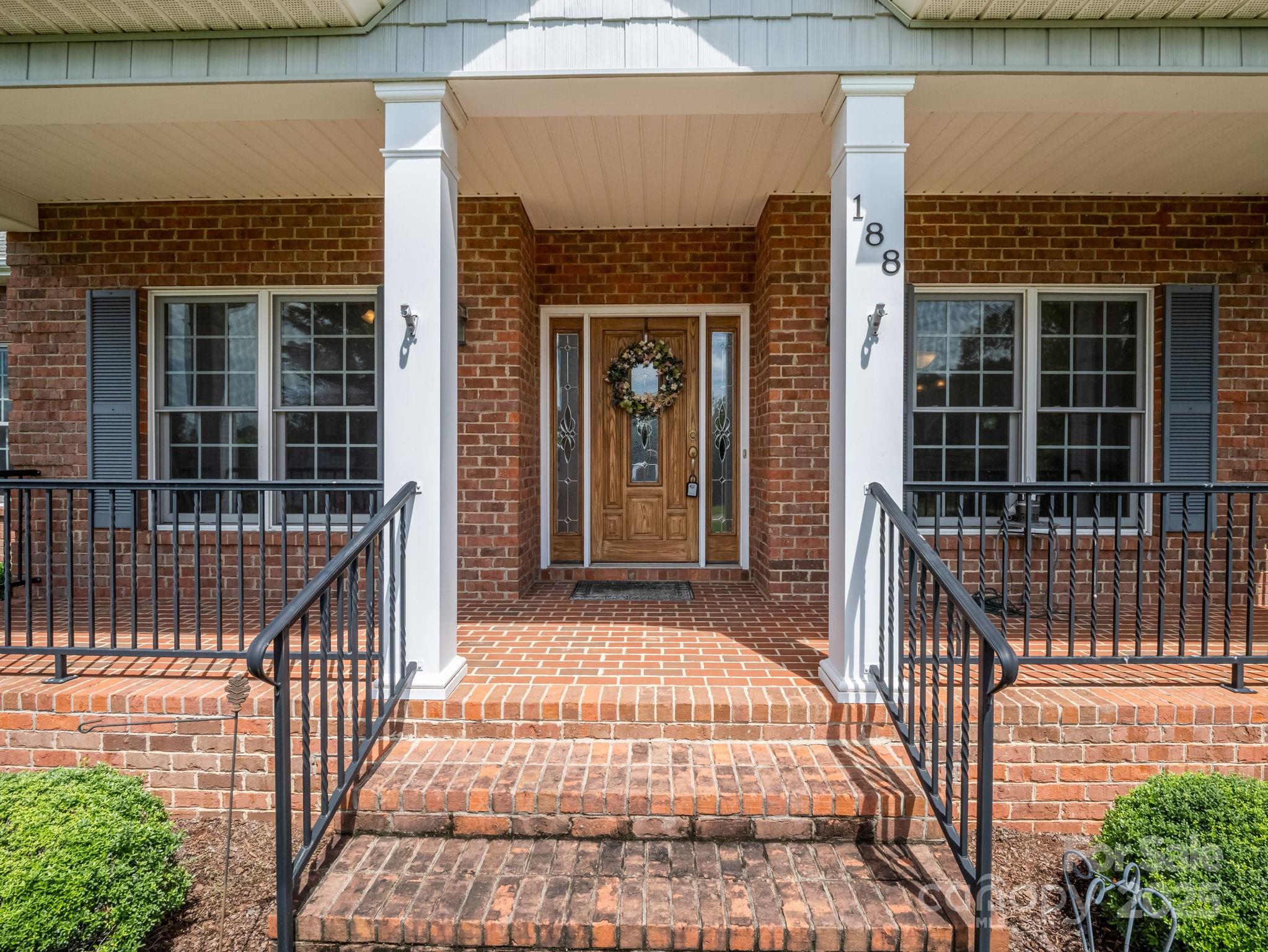 188 Jamesfield Drive Rutherfordton, NC 28139 - Photo 3 of 45 a view of a balcony with a potted plant and stairs