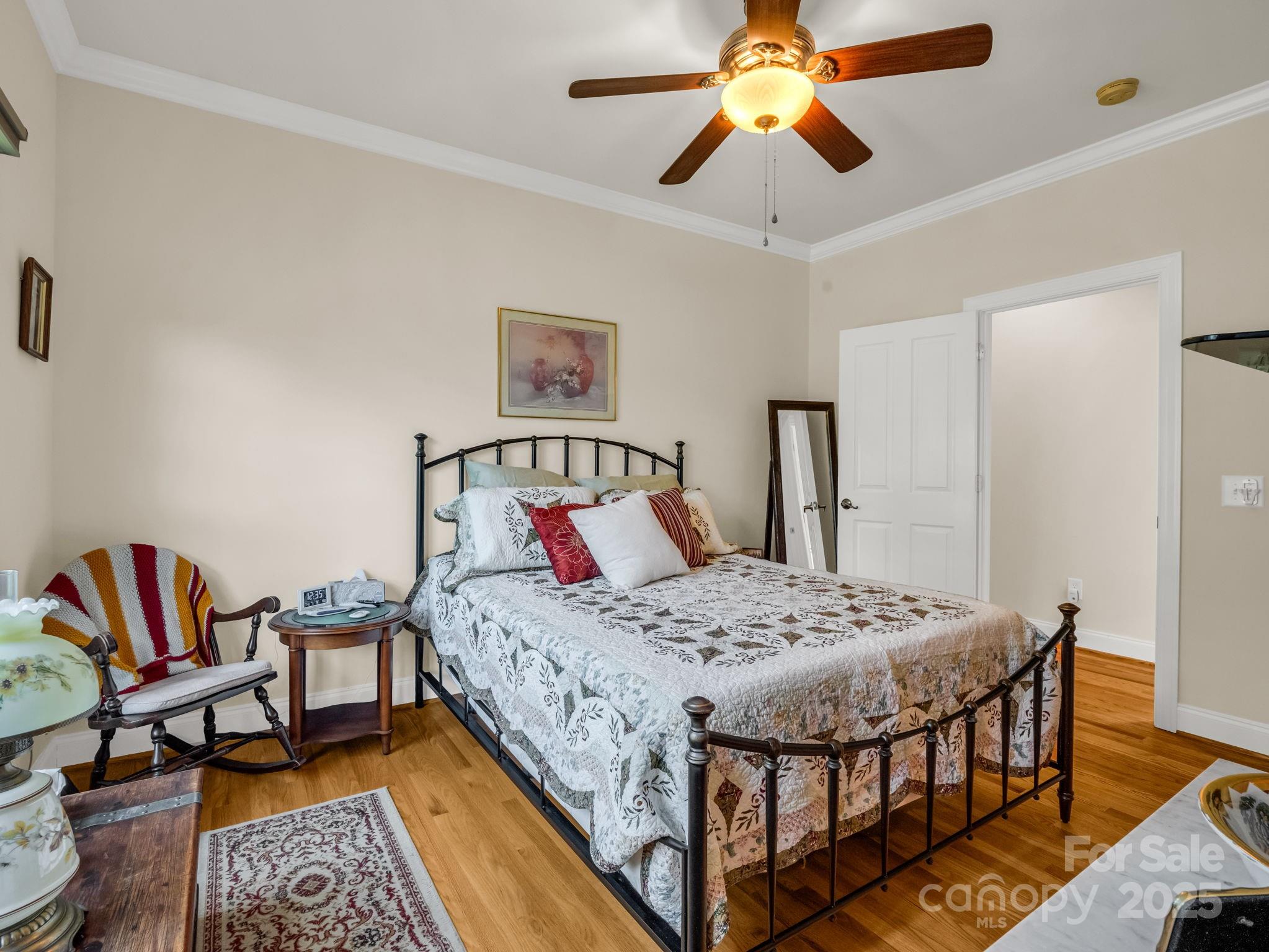 188 Jamesfield Drive Rutherfordton, NC 28139 - Photo 35 of 45 a bedroom with a bed and a chandelier