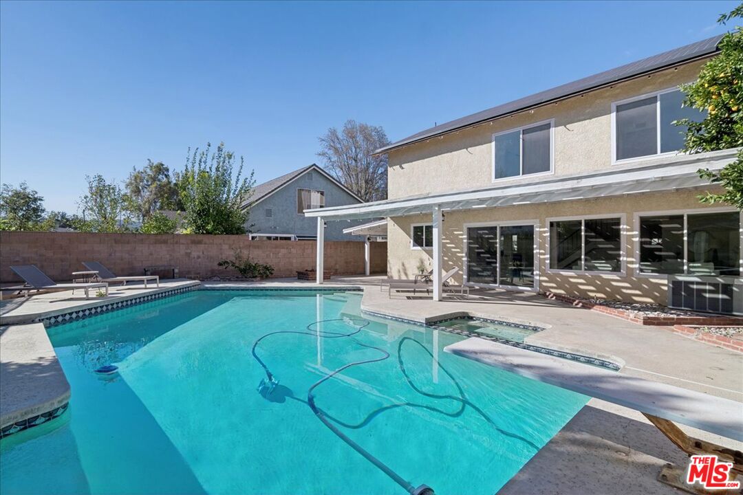 2216 Carlsbad Court Simi Valley, CA 93063 - Photo 14 of 32 a view of a house with swimming pool and sitting area