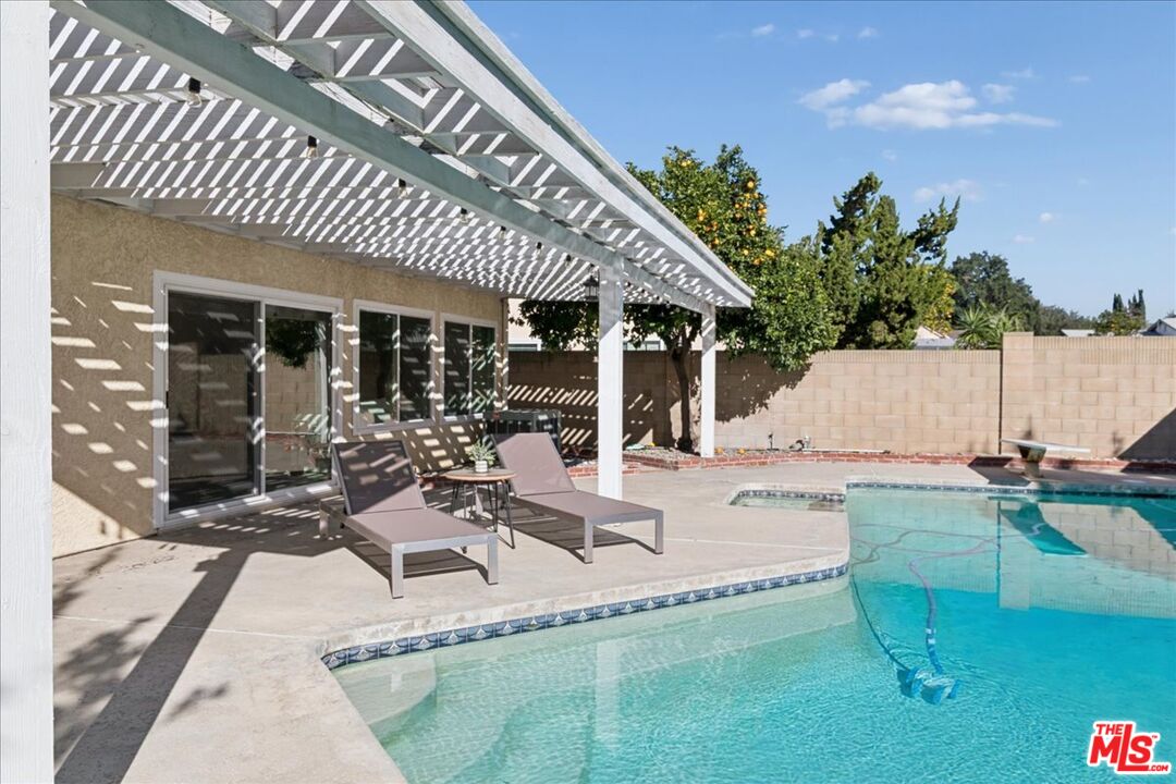 2216 Carlsbad Court Simi Valley, CA 93063 - Photo 18 of 32 a view of a swimming pool with outdoor seating and a patio